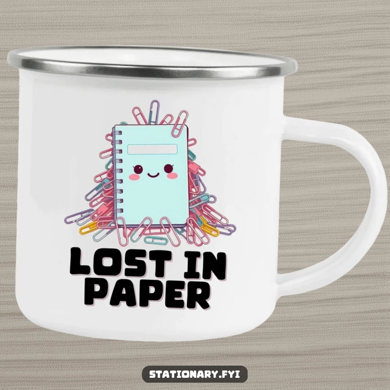 Funny Camping Mug: A tiny notebook dwarfed by paperclips, symbolizing a humorous struggle in the great outdoors.