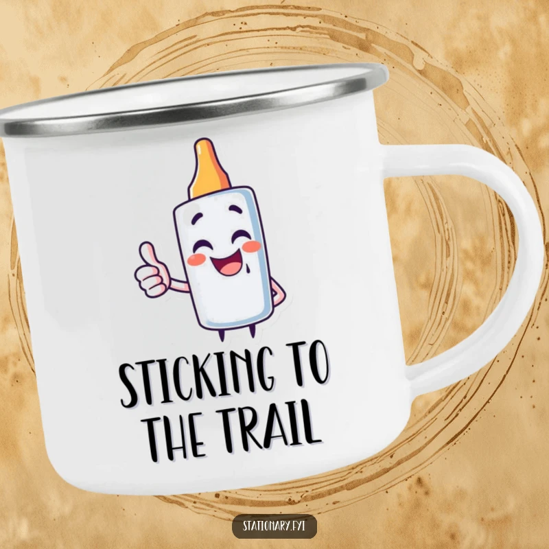 Funny enamel camping mug featuring a giggling glue stick character giving a thumbs up, perfect for outdoor fun.