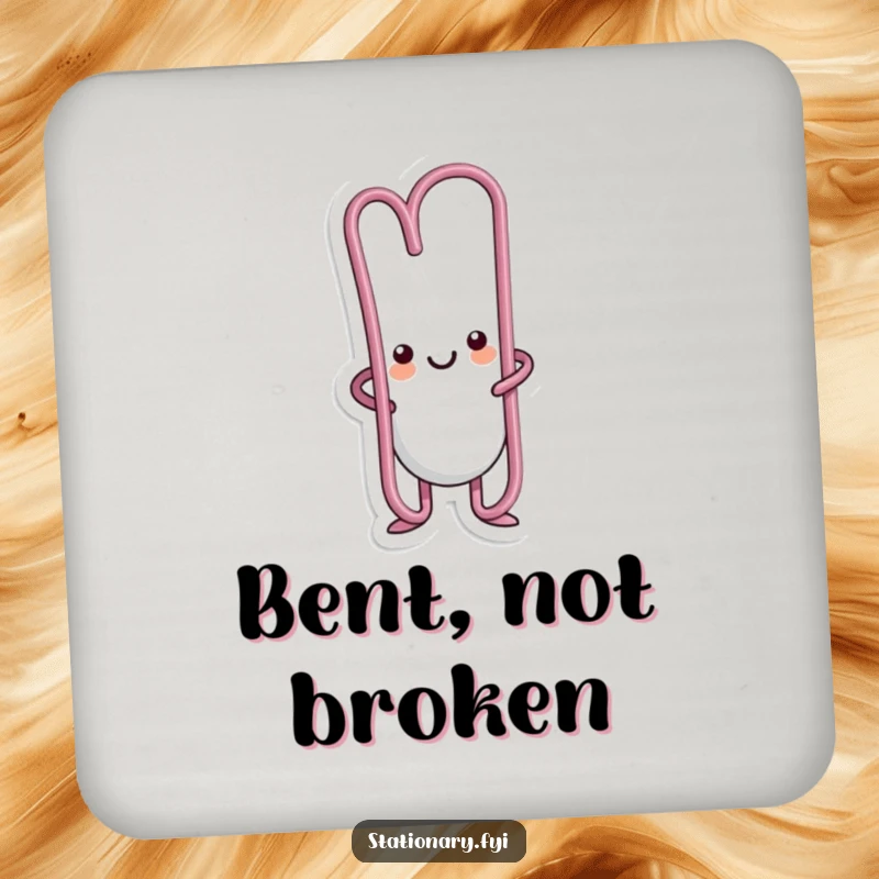 Funny kawaii paperclip character bent into an amusing shape on this humorous drink coaster.