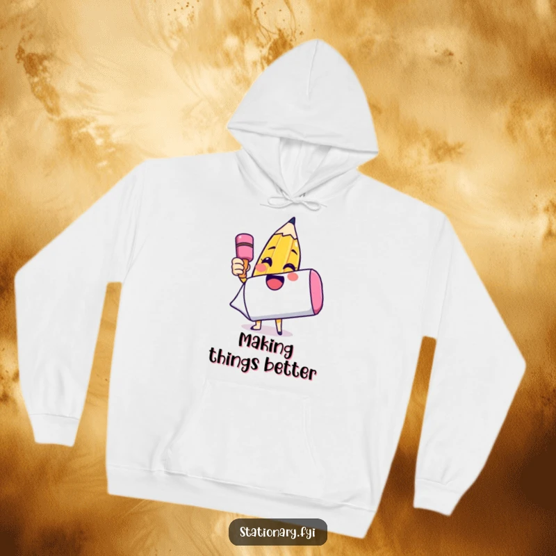 Funny hoodie with a joyful pencil character drawing a smiley face on an enormous eraser, celebrating artistic expression and happiness.