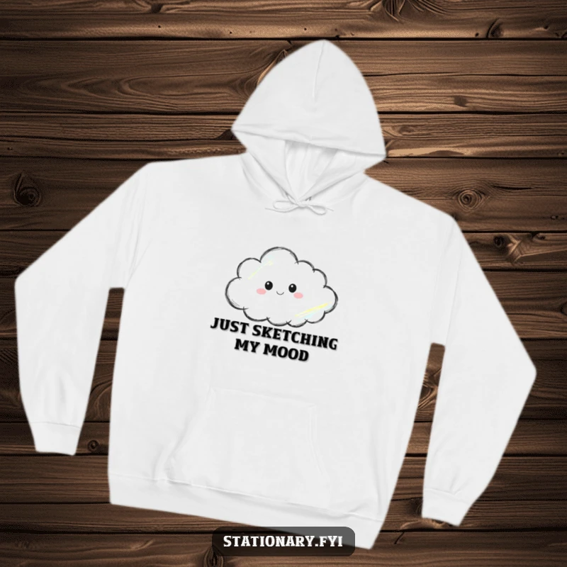 Funny hoodie featuring a crayon thoughtfully sketching a cloud, offering warmth alongside artistic inspiration and humor.