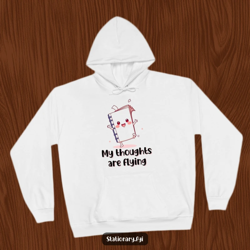 Funny Kawaii Notebook Hoodie featuring a cartwheeling character with pages flying, offering warm and humorous creative expression.