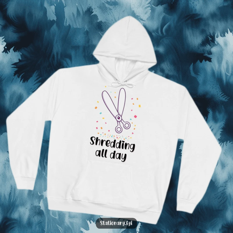 Funny hoodie featuring a giggling pair of scissors mid-cut through a flurry of confetti, embodying festive fun.