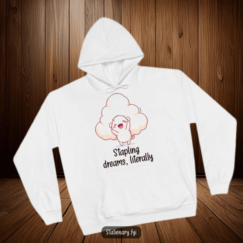 Funny hoodie depicting a cute, fuzzy creature energetically trying to staple a huge, fluffy cloud, celebrating quirky ambition.