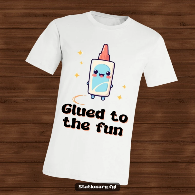 Funny T-Shirt depicting a playful glue stick with a sparkly trail, perfect for artists and craft lovers.