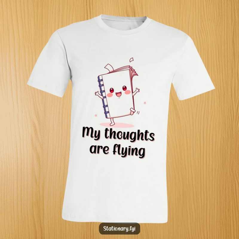 Funny Kawaii Notebook T-Shirt captured mid-cartwheel with flying pages, a humorous expression of joy and creativity.