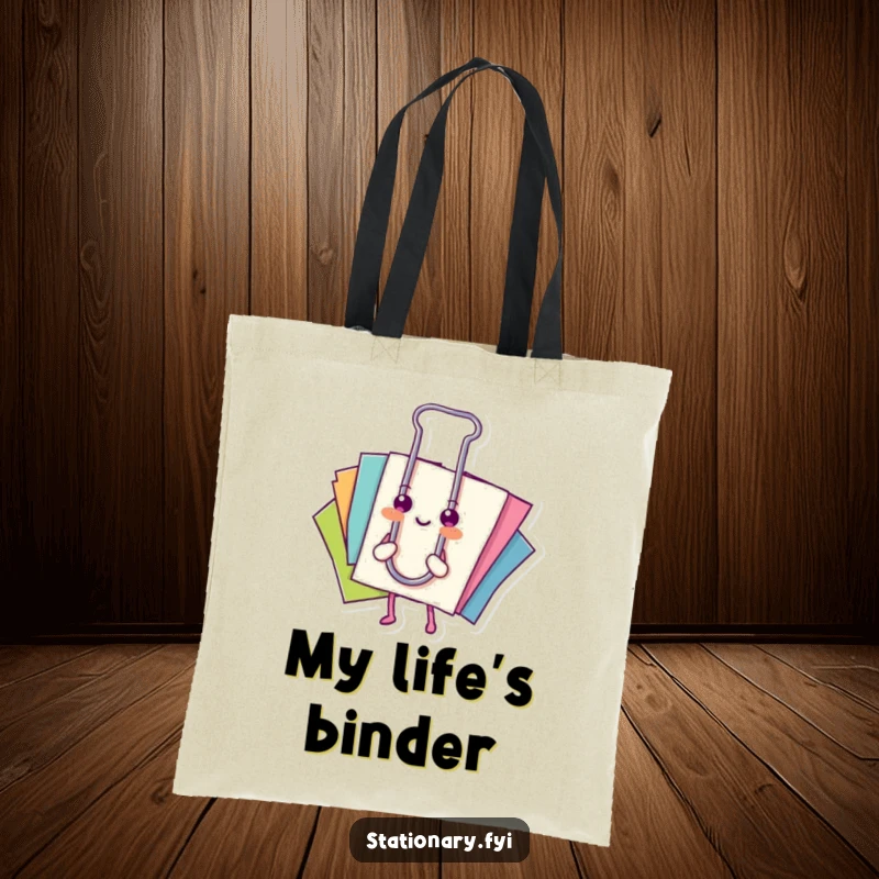 Funny tote bag: A happy paperclip holds together colorful papers, perfect for carrying daily items.