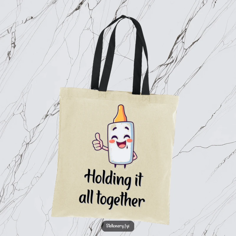 Funny tote bag showcasing a giggling glue stick character giving a thumbs up, perfect for carrying craft supplies.