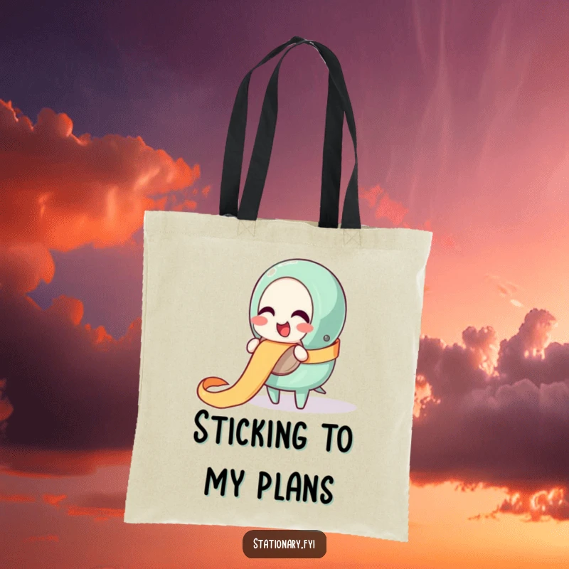 Funny tote bag with a giggling tape dispenser character happily unraveling a ribbon, perfect for carrying items with fun.